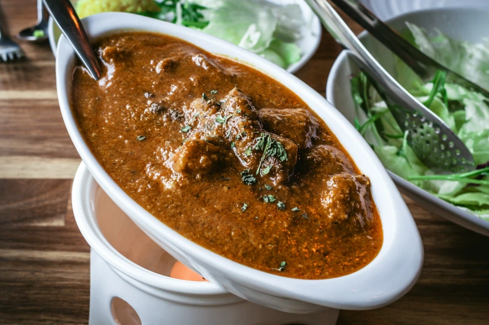 A close up of a bowl of food on a table